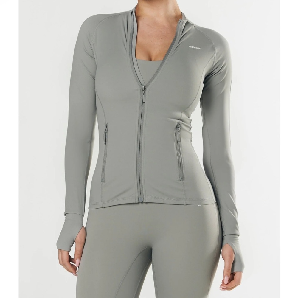 Second left grey sports jacket workout size S